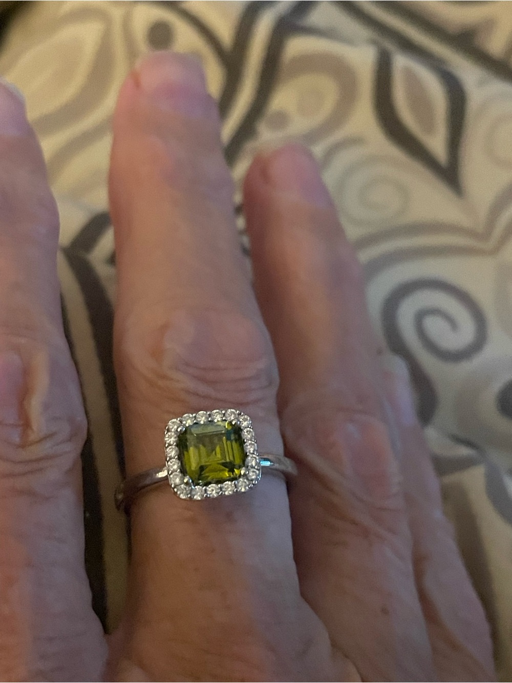 Silver Ring with Green Square Gem and Halo of Accents